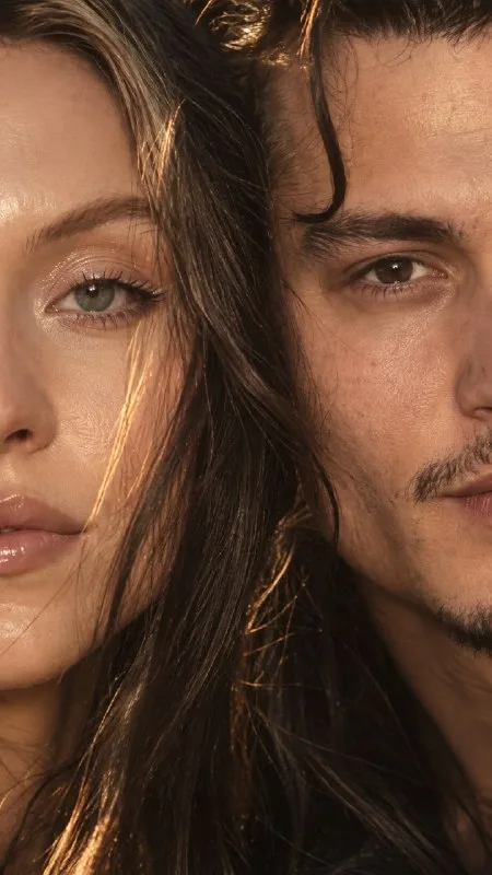 Preserve 100% of both subjects’ facial identity and features from the reference image, including eye shape,