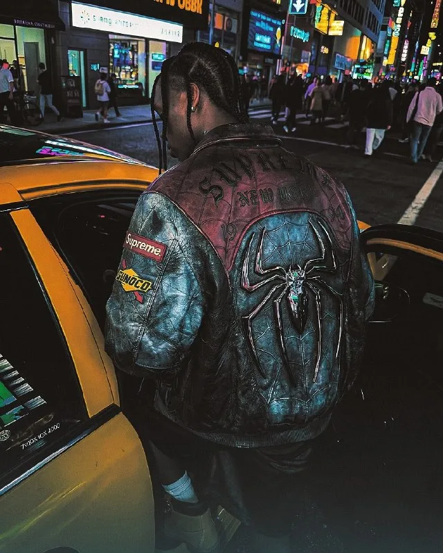 A straight-on medium shot depicts a young Black man in an urban nighttime environment, stepping into